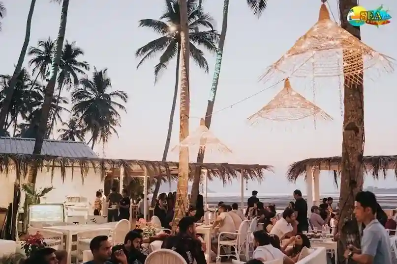 A small crowd sitting at the Thalassa by the Vagator Beach in North Goa